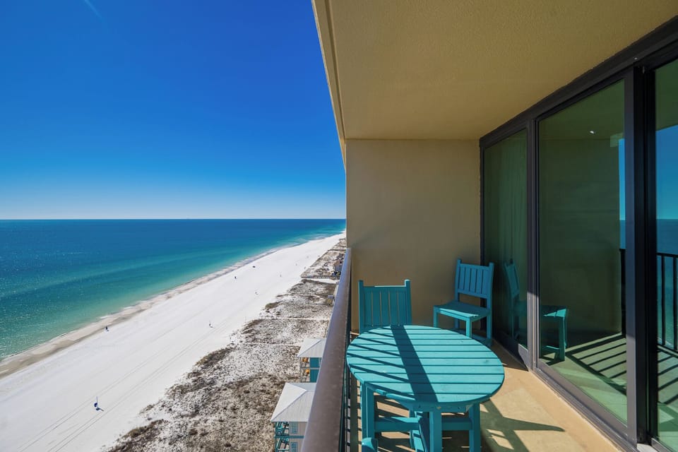 Your balcony invites you to savor the endless blue horizon and lively beach below