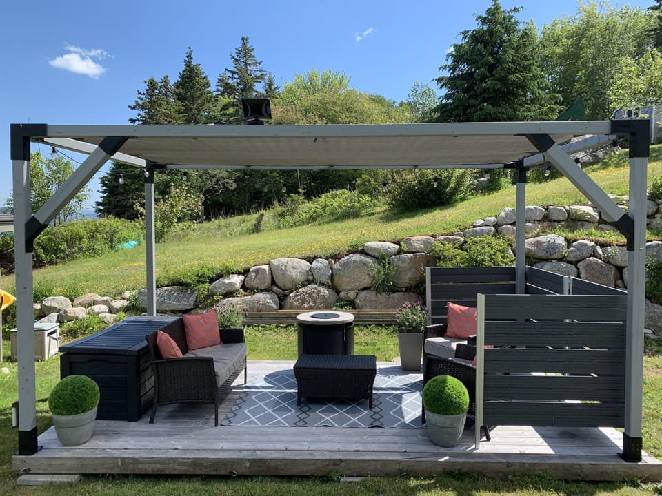 Relax on the 8x16 deck with shade sail and propane fireplace.
