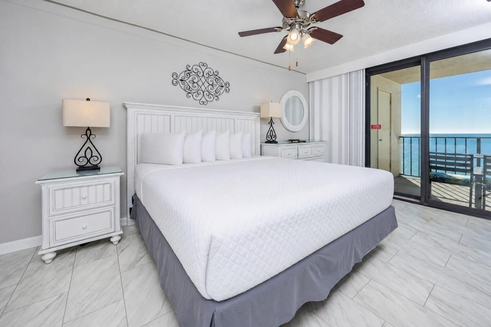 Unwind in the king master suite, enjoying views of the coast from your beachfront balcony