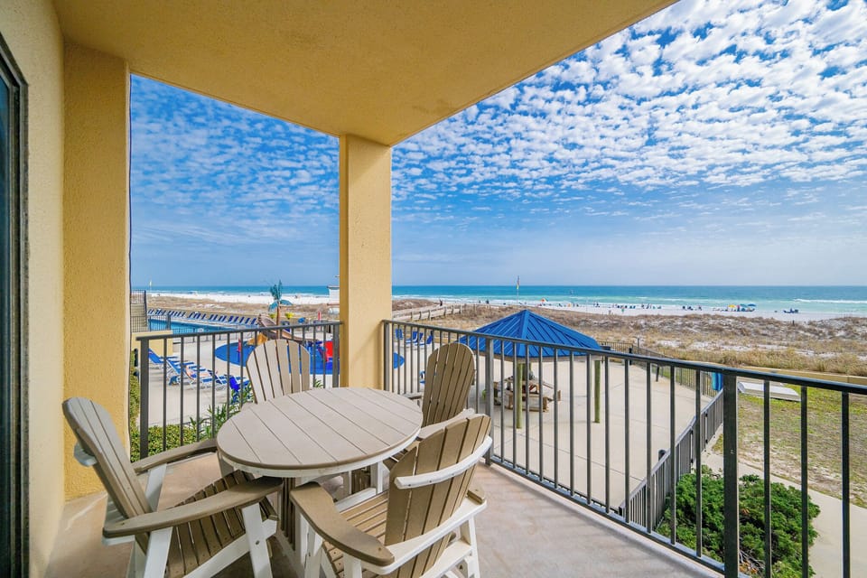 Your balcony invites morning coffee with gulf breezes and soft waves just beyond the railings