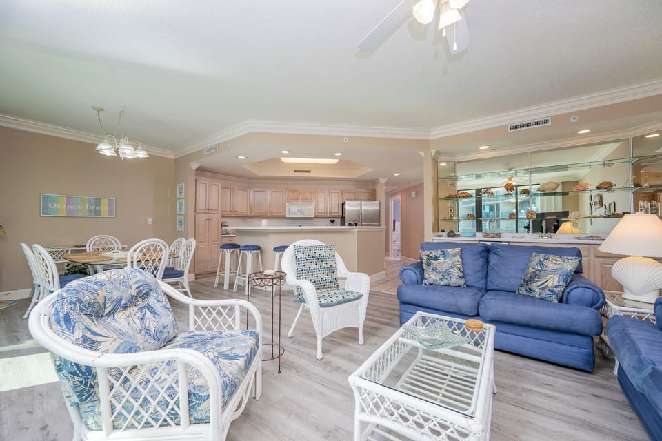 Relax on the cozy sofa with a queen sleeper in this inviting family room with beautiful balcony views