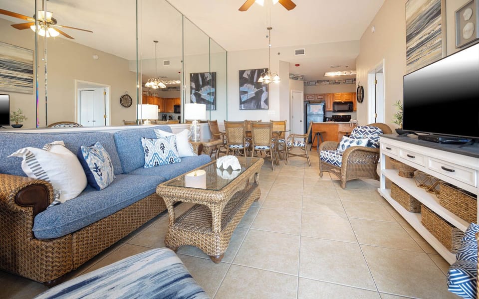 Relax on the cozy sofa with queen sleeper, surrounded by coastal decor, and enjoy the open layout