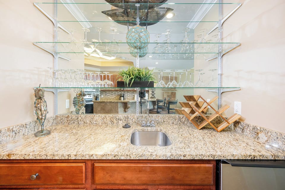 Mix your favorite drinks at the stylish wet bar, surrounded by elegant glassware and inviting decor