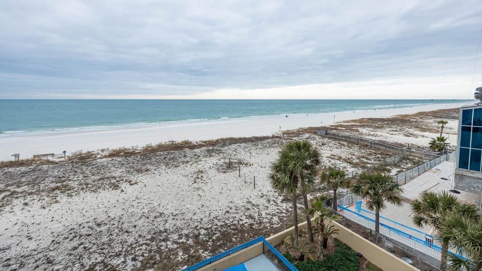 Breathe in the fresh air while enjoying views of the tranquil shoreline and gentle waves from your balcony
