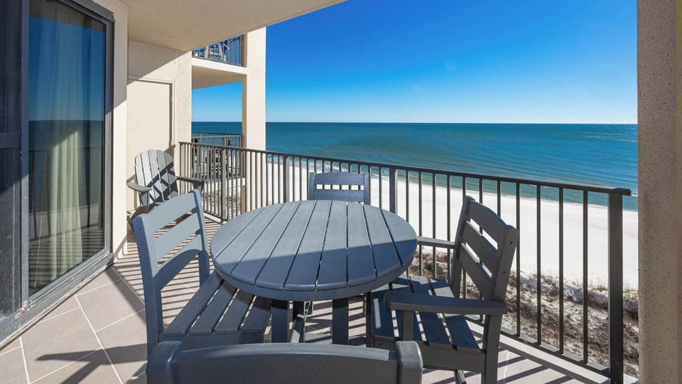 Relax at the outdoor table while enjoying refreshing breezes and expansive views of the tranquil waters