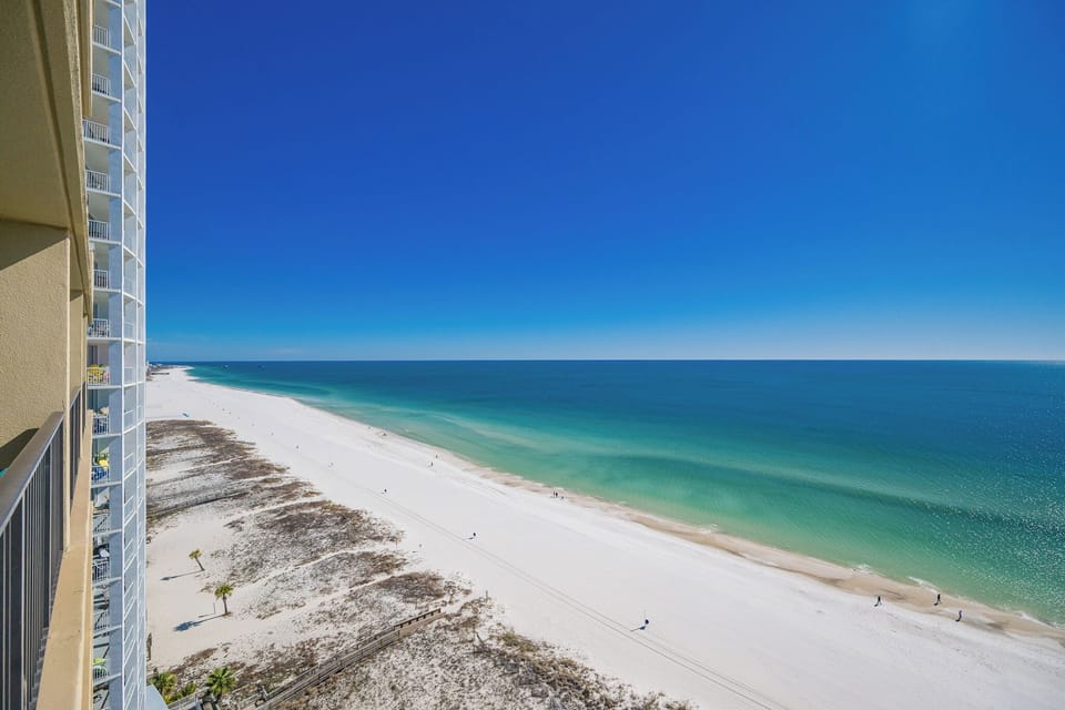 Tranquil, endless blue stretches across the coast as you savor peaceful moments from your balcony