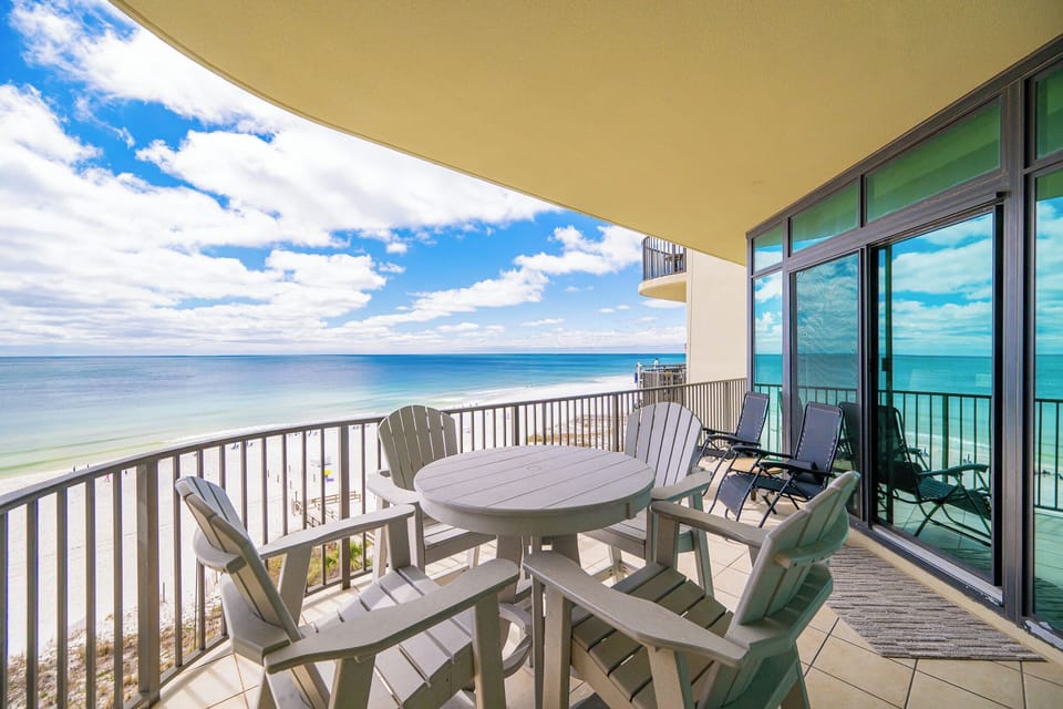 Relax on your balcony while soaking in the stunning views of the beach and the calming coast breeze