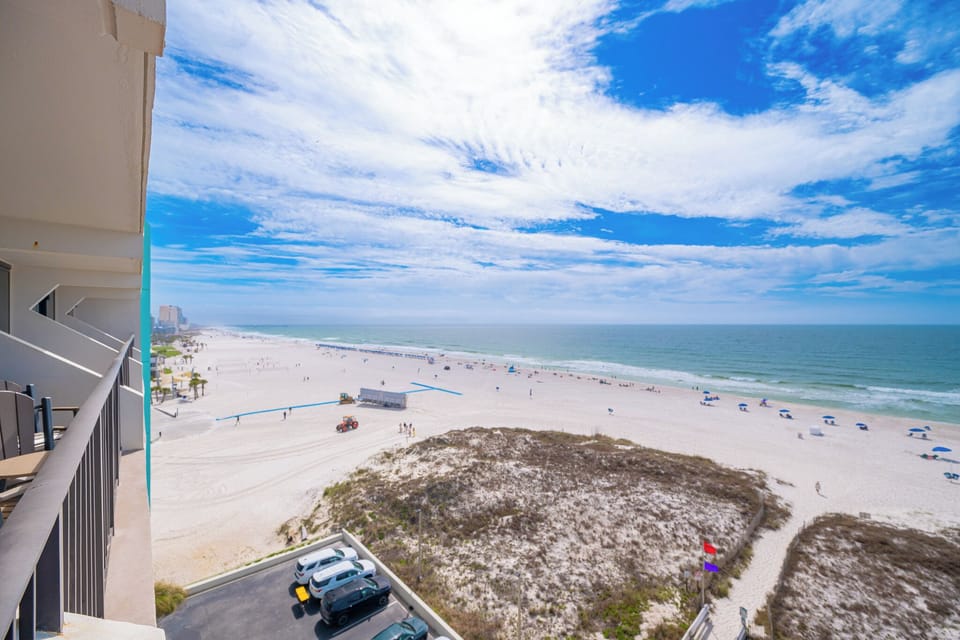 Breathe in the coast air from your balcony while soaking in expansive views and watching beachgoers enjoy the shore