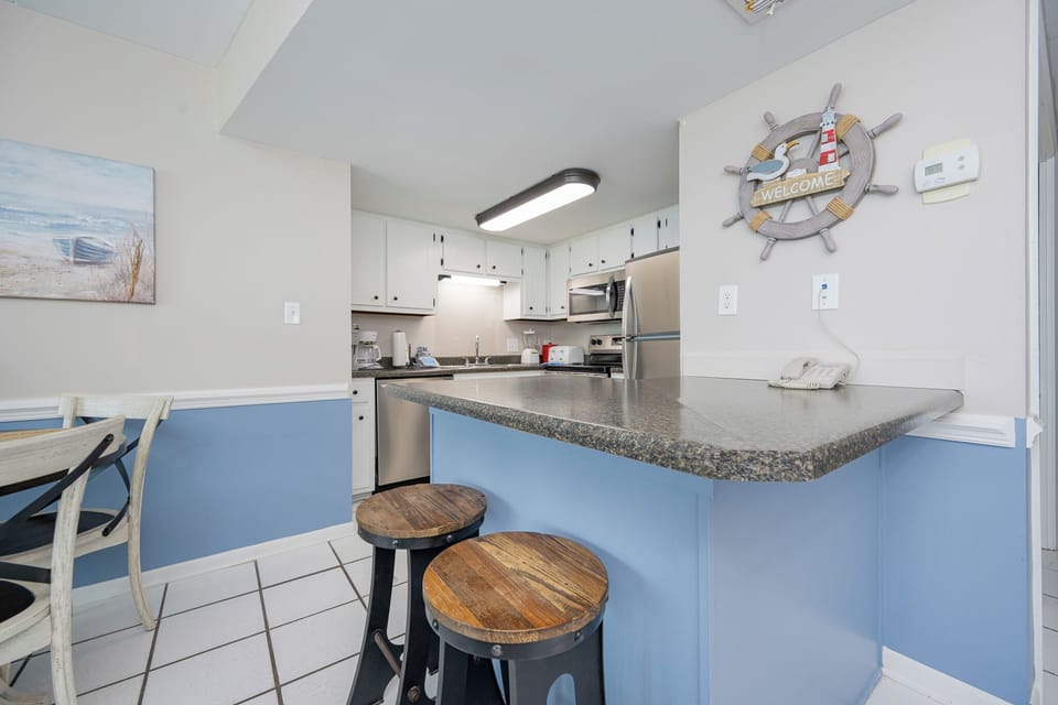 Unwind on sleek stools by your breakfast bar while savoring coastal snacks and sharing good times with loved ones