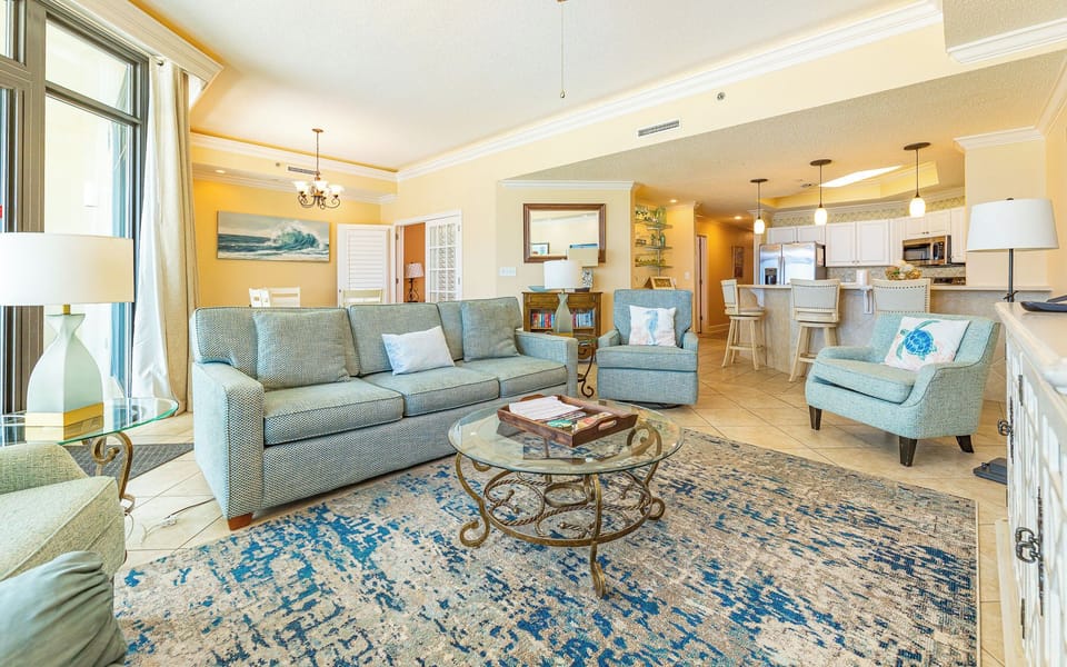 In the living room, soft cushions invite you to unwind and share stories after a day at the shore