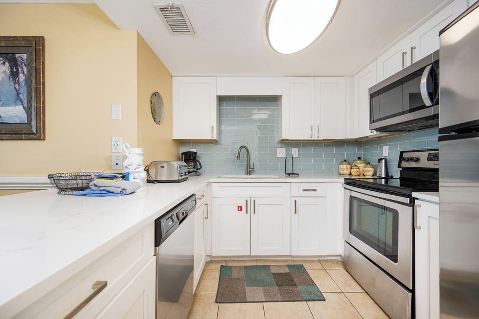 Craft delicious meals in your kitchen, equipped with stainless appliances and inviting decor that enhances your stay