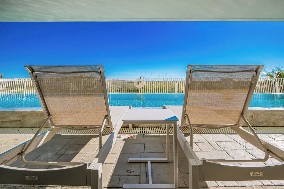 Relax by the poolside with stunning views and comfortable loungers, perfect for unwinding in a serene setting