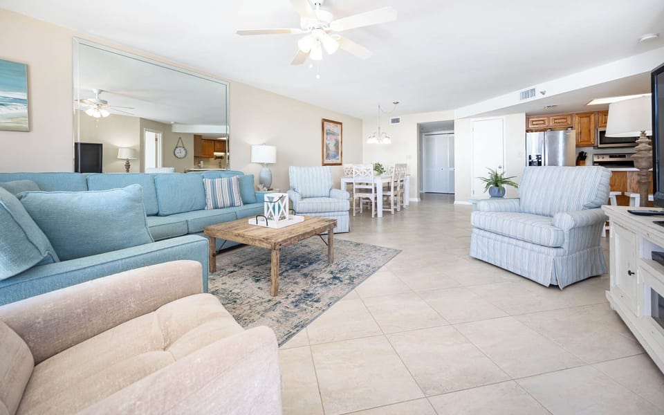Relax in the spacious living area, featuring soft seating and a welcoming atmosphere