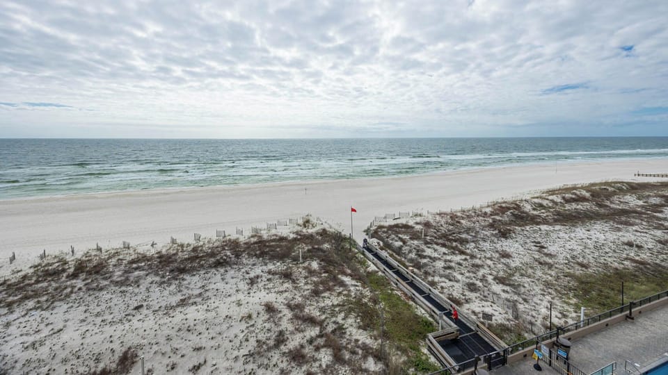 Enjoy the expansive shoreline and gentle waves, perfect for a day of relaxation and beachside adventures
