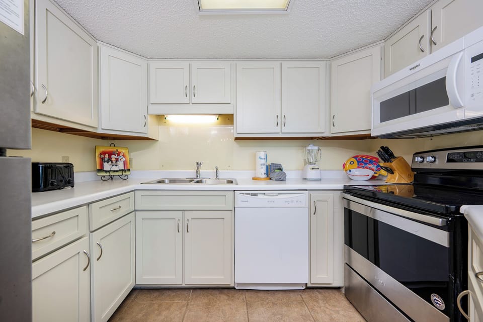 Bright kitchen with stainless steel appliances where your family prepares fresh gulf coast meals together