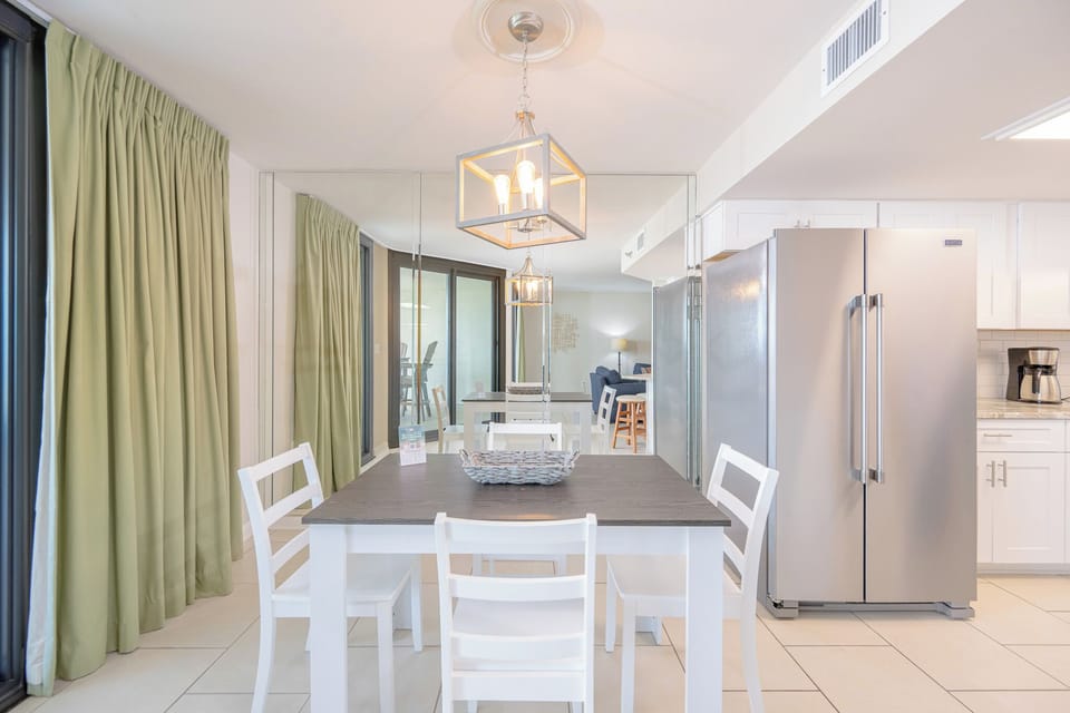 Gather around the dining table, surrounded by natural light and a welcoming vibe, perfect for family gatherings