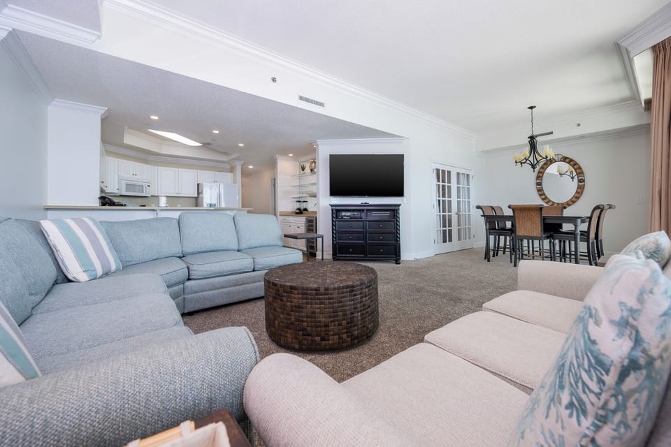 Experience cozy family moments in the inviting living area, featuring a queen sofa sleeper and elegant accents