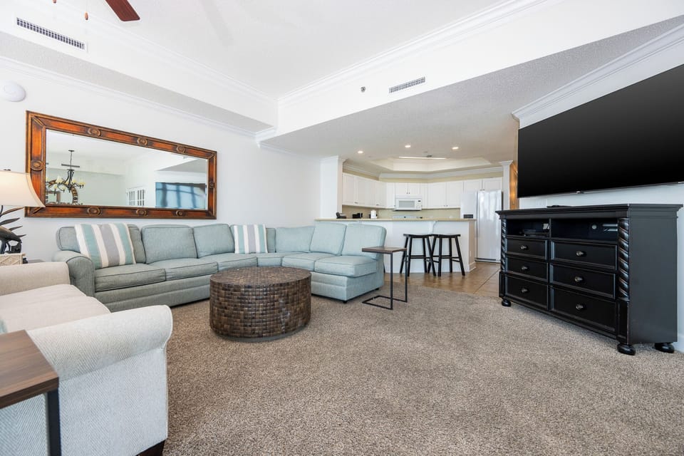 Unwind in the spacious living area, where plush seating invites family gatherings and laughter flows effortlessly
