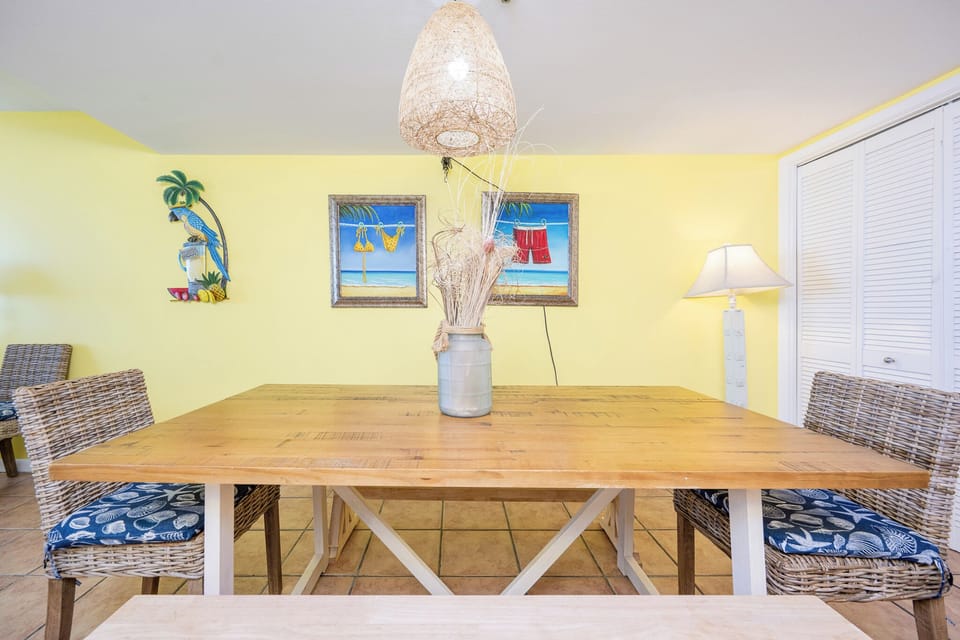 Immerse yourself in coastal vibes while sharing stories around the large dining table, accented by cheerful decor