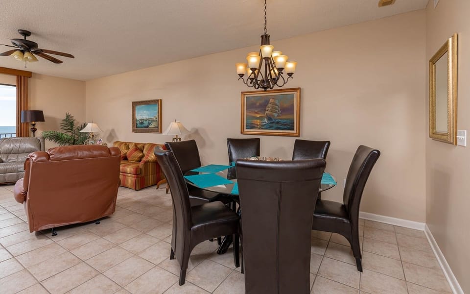 Relax in the inviting living area, featuring comfortable seating and a dining table perfect for meals with loved ones