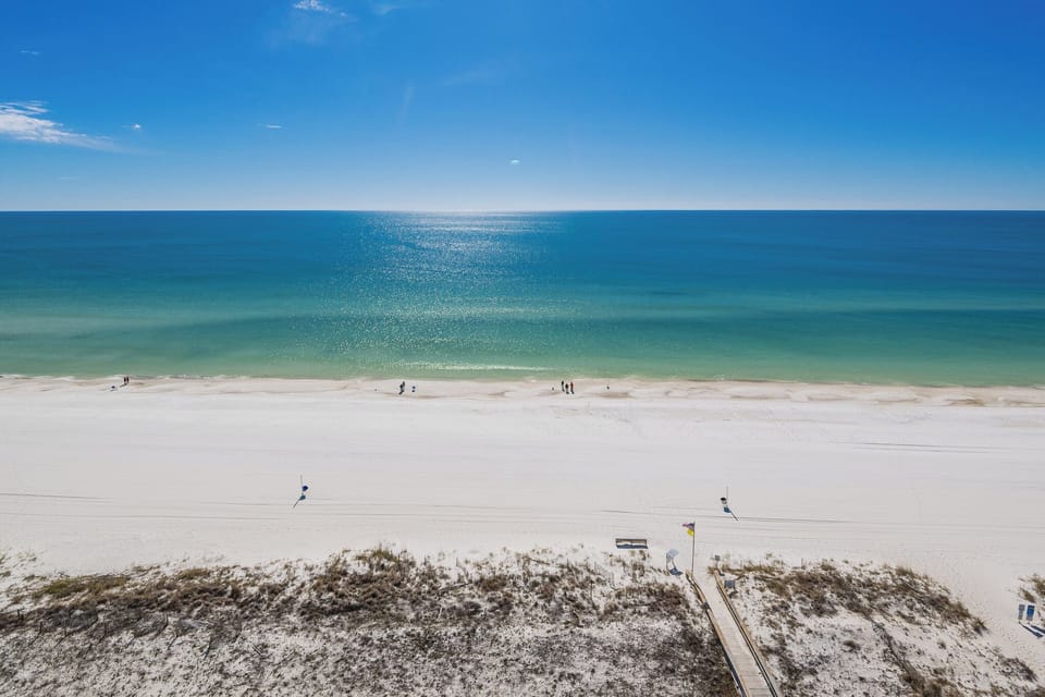 Tranquil, endless blue stretches across the coast as you savor peaceful moments from your balcony