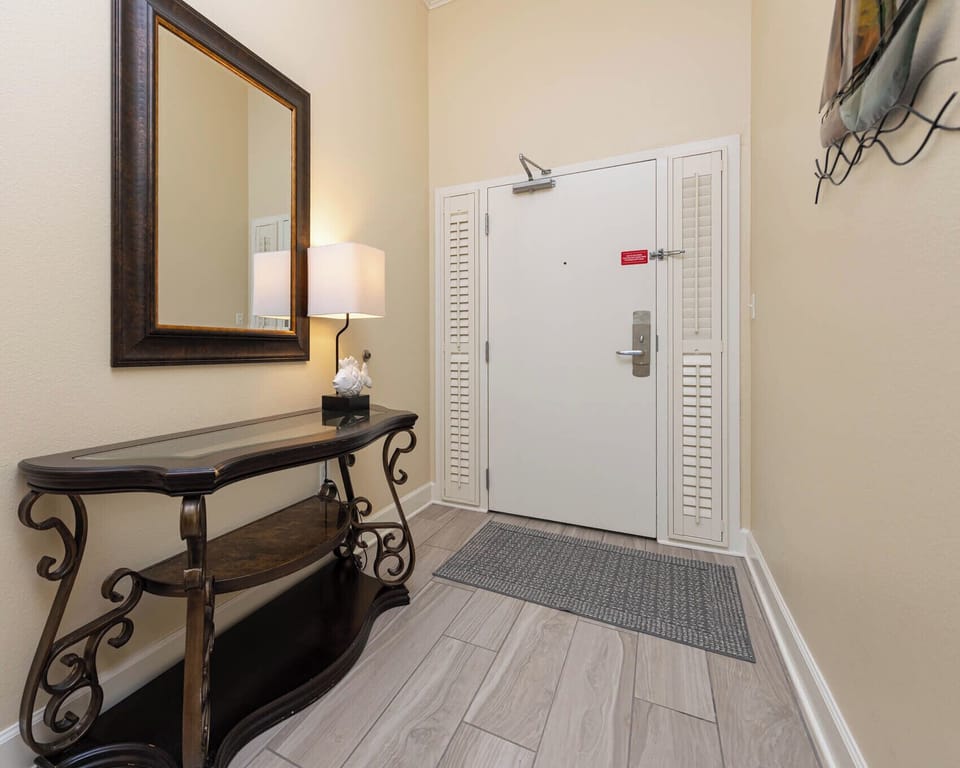 Step into a welcoming entryway, where charm and coastal vibes greet you upon arrival at your beach retreat