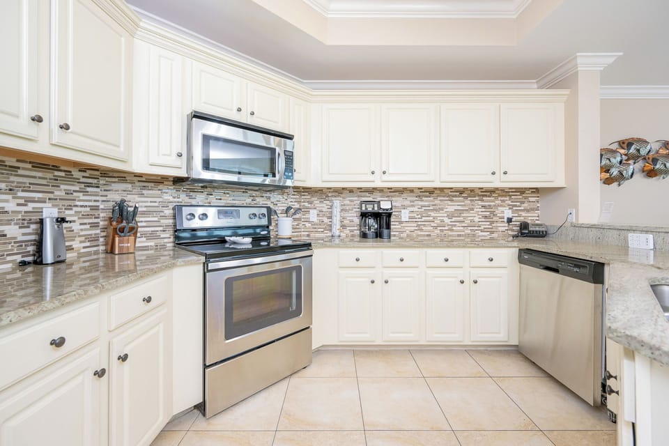 Create culinary delights in this stylish kitchen with stainless appliances and inviting ambiance for family fun