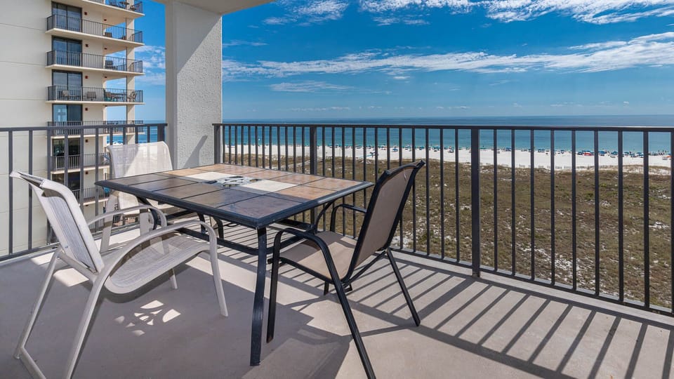 Balcony seating offers a relaxing spot to enjoy views of the beach and the tranquil gulf waters beyond