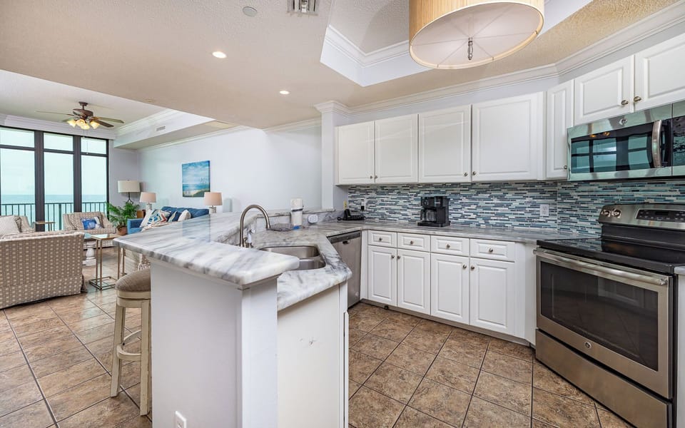 Prepare your favorite recipes in this inviting kitchen, enjoying warm vibes as you mix and mingle with loved ones