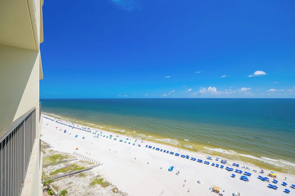 Gaze at the expansive coast from your balcony, feeling the breeze and savoring the soothing sounds of the waves