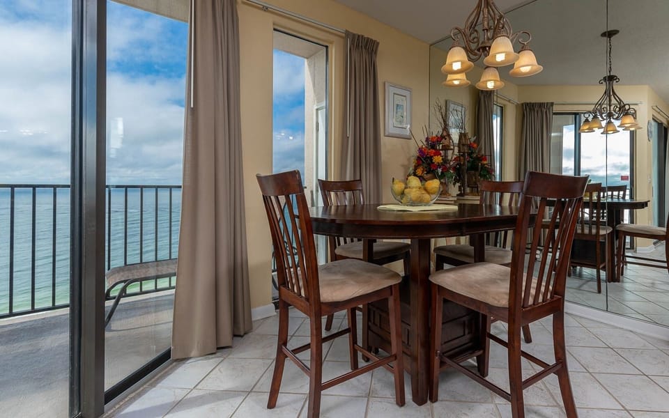 Dine at the round table while enjoying beautiful views through large windows that invite natural light