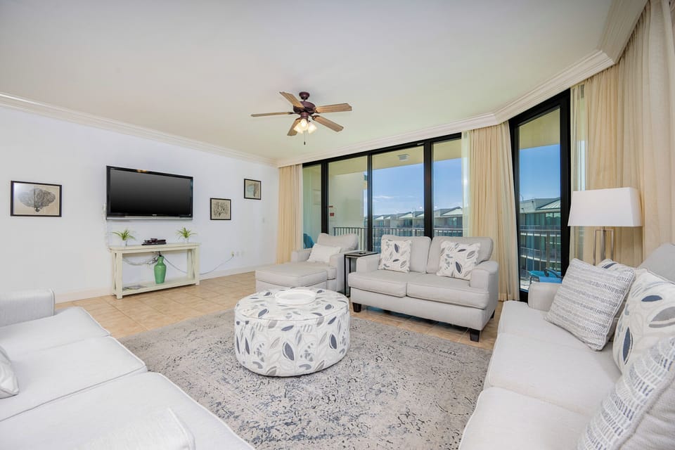 Unwind in the inviting living area, enjoying your favorite shows while soaking in the coastal views