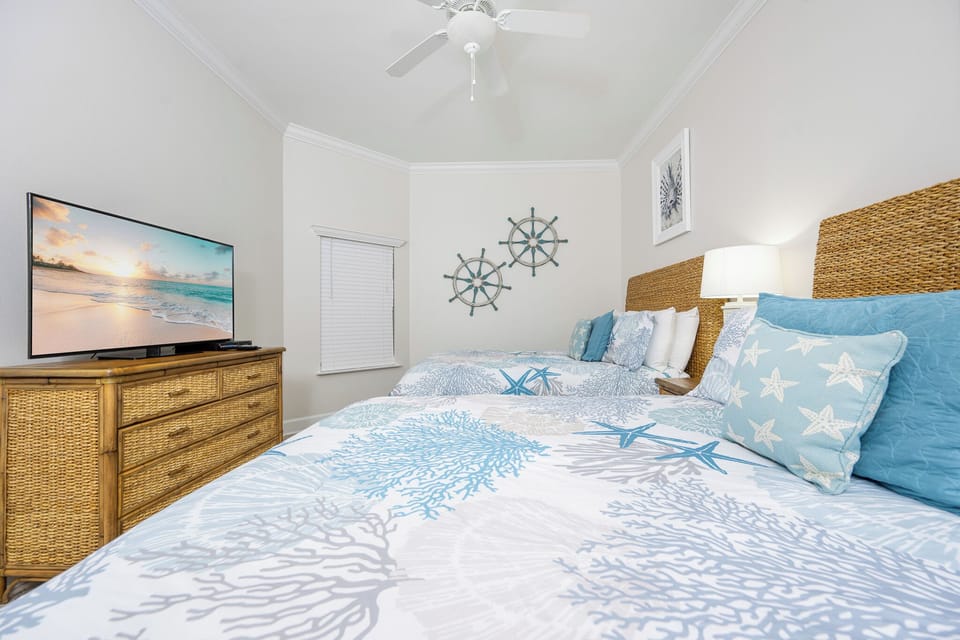 Relax on one of the cozy queen beds in this guest suite and enjoy a peaceful slumber