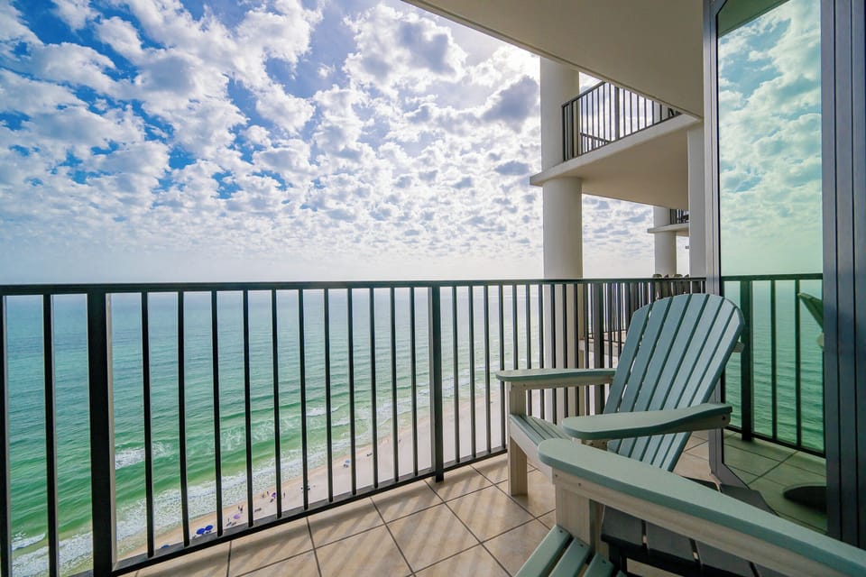 Relax in the inviting chairs on your balcony, soaking in breathtaking views of the beautiful coast