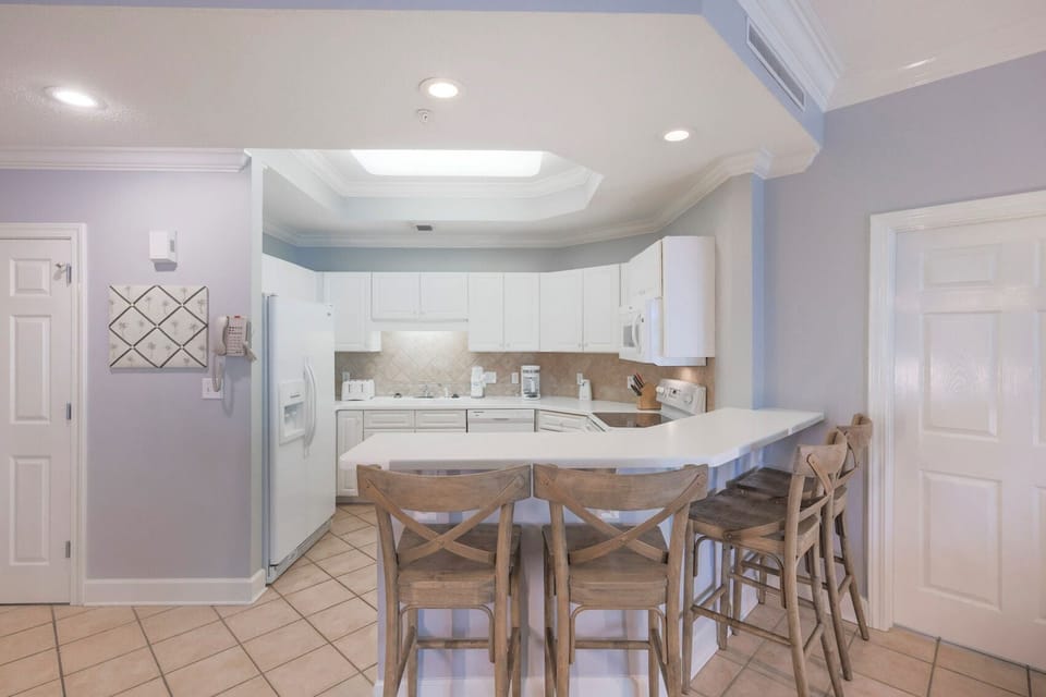 Sip your morning coffee at the breakfast bar and get ready for a day of adventure in this stylish space