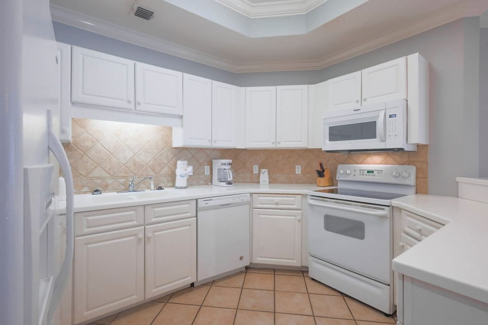 Prepare your favorite meals with ease in this bright kitchen, enjoying the spacious design