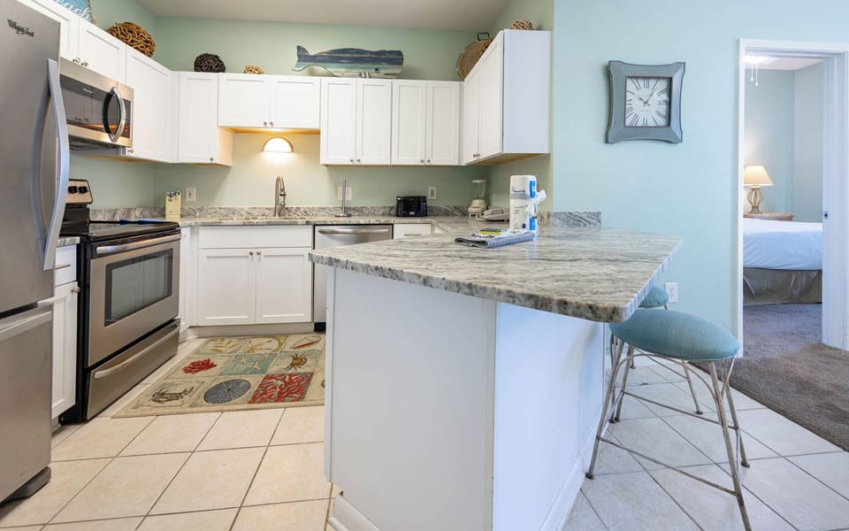 Gather your family around the kitchen bar for fun conversations while enjoying the beach vibe of your coastal home