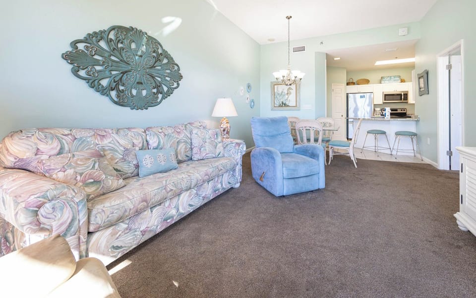 Cozy living area with a queen sofa sleeper and playful decor with an inviting ambiance