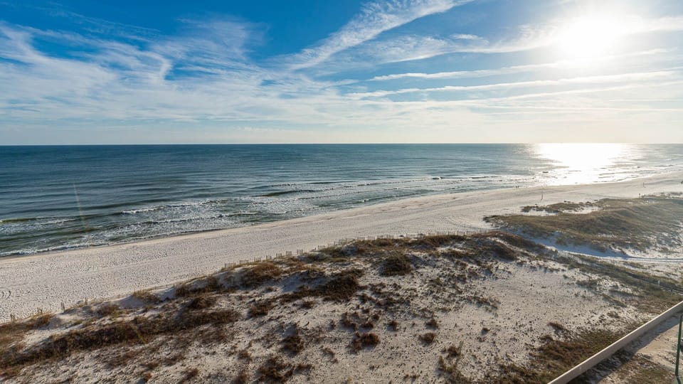 Breathe in the fresh air and enjoy the scenic views of the tranquil waters and shoreline from your balcony