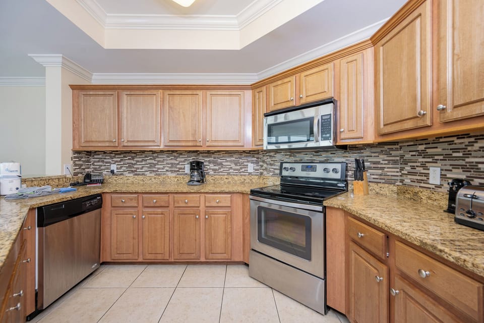 Experience a modern kitchen with stainless appliances and elegant granite countertops, perfect for your culinary adventures