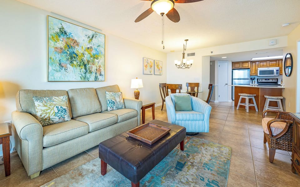 Soft couch cushions invite you to relax in the living room as you enjoy your favorite movie or read a book
