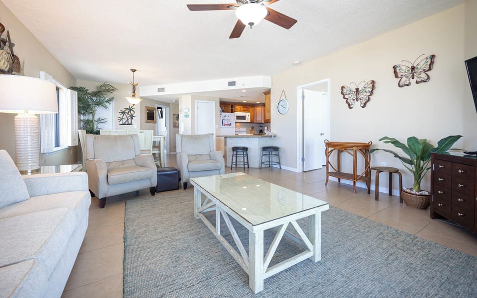 Relax in the spacious living area, featuring a sofa with queen sleeper, stylish coffee table, and a welcoming atmosphere