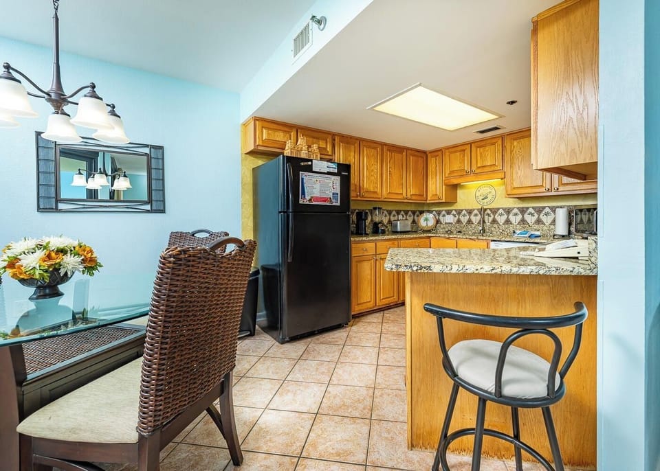 Take a seat at the breakfast bar as you prepare fresh meals in this cozy kitchen and dining area