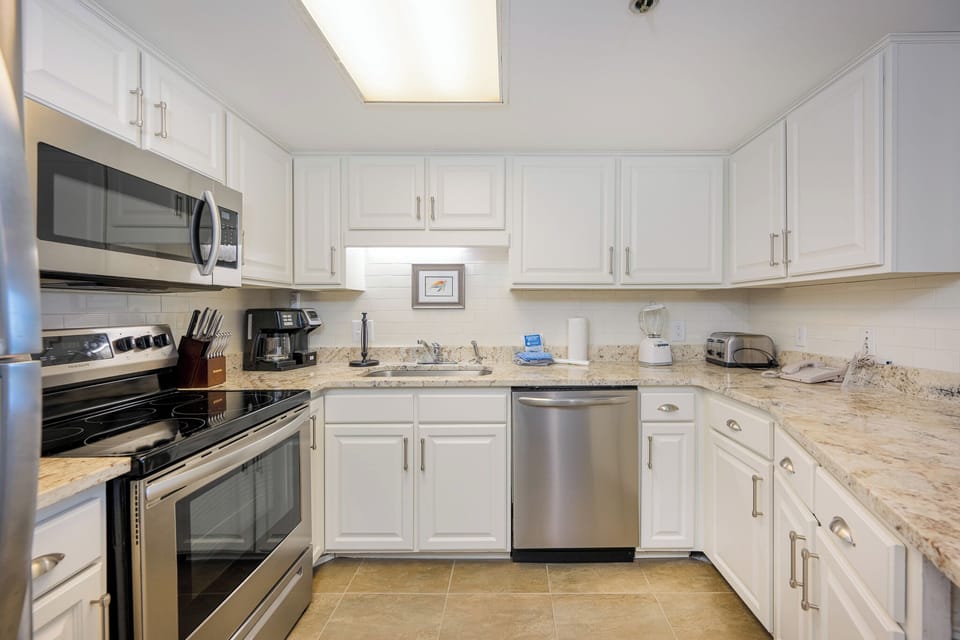 Enjoy cooking in this inviting kitchen with stainless appliances, granite countertops, and a breakfast bar