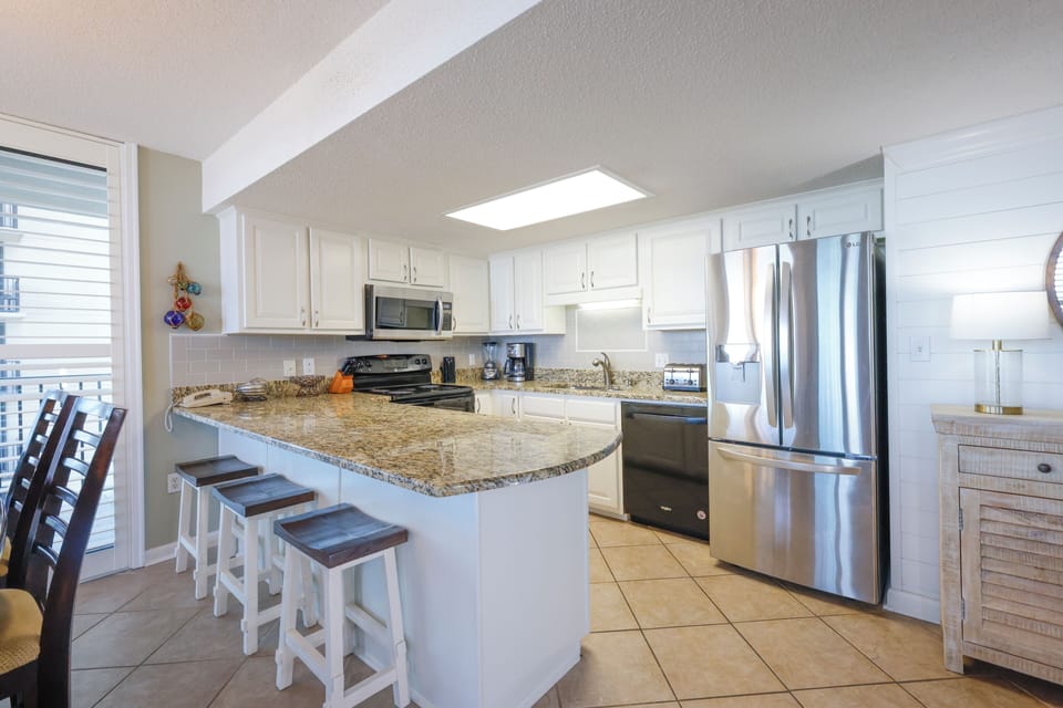 Spend time with the family at the breakfast bar and prepare meals in this stylish kitchen area