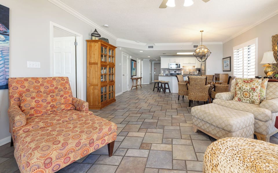 The living room welcomes you with cozy seating perfect for quiet reading or catching a favorite show after a day out