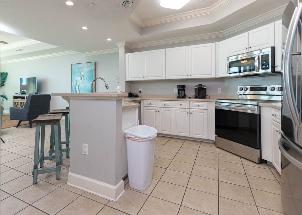 Craft delightful snacks and meals in the stylish kitchen, where each corner invites shared moments of joy