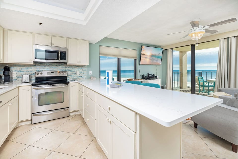 Craft delicious meals in this elegant kitchen with stainless appliances and a stylish backsplash