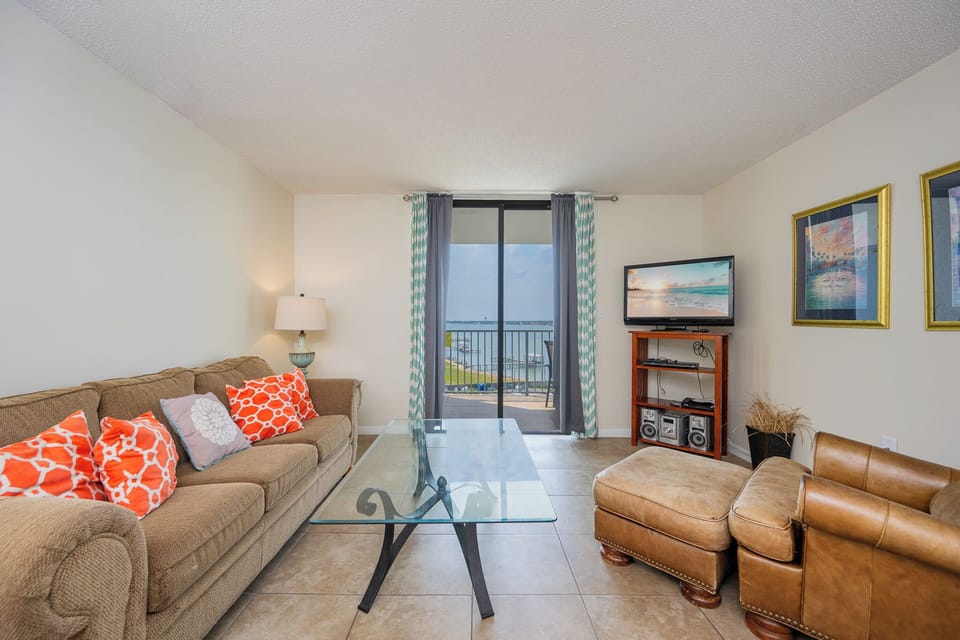 Relax in the cozy living area, where you can stream your favorite shows and enjoy beautiful lagoon views