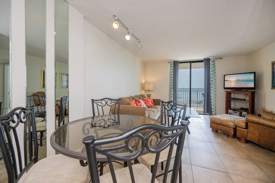 Gather around the glass dining table, soaking in the lagoon view and enjoying laughter-filled moments with family